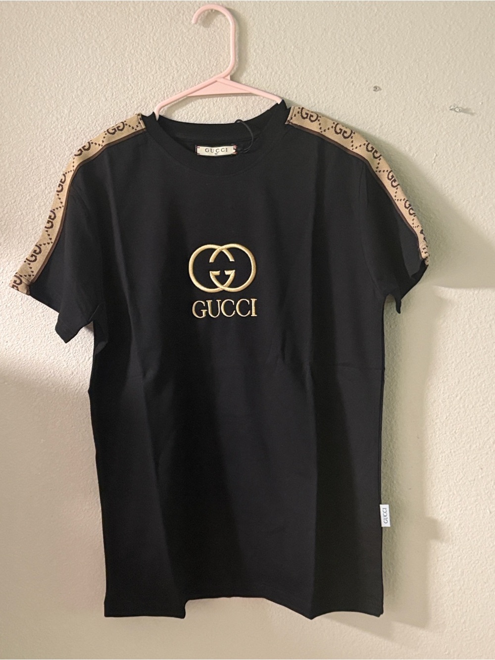 Gucci Black Tee with Beige GG Shoulder Stripes and Gold Logo